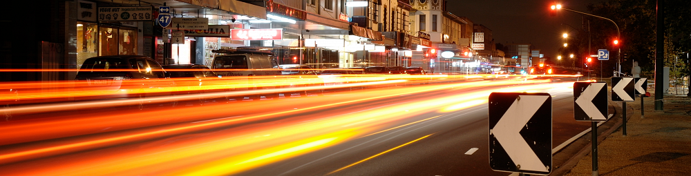 Time-lapse image of traffic tailights making a horitzontal pattern